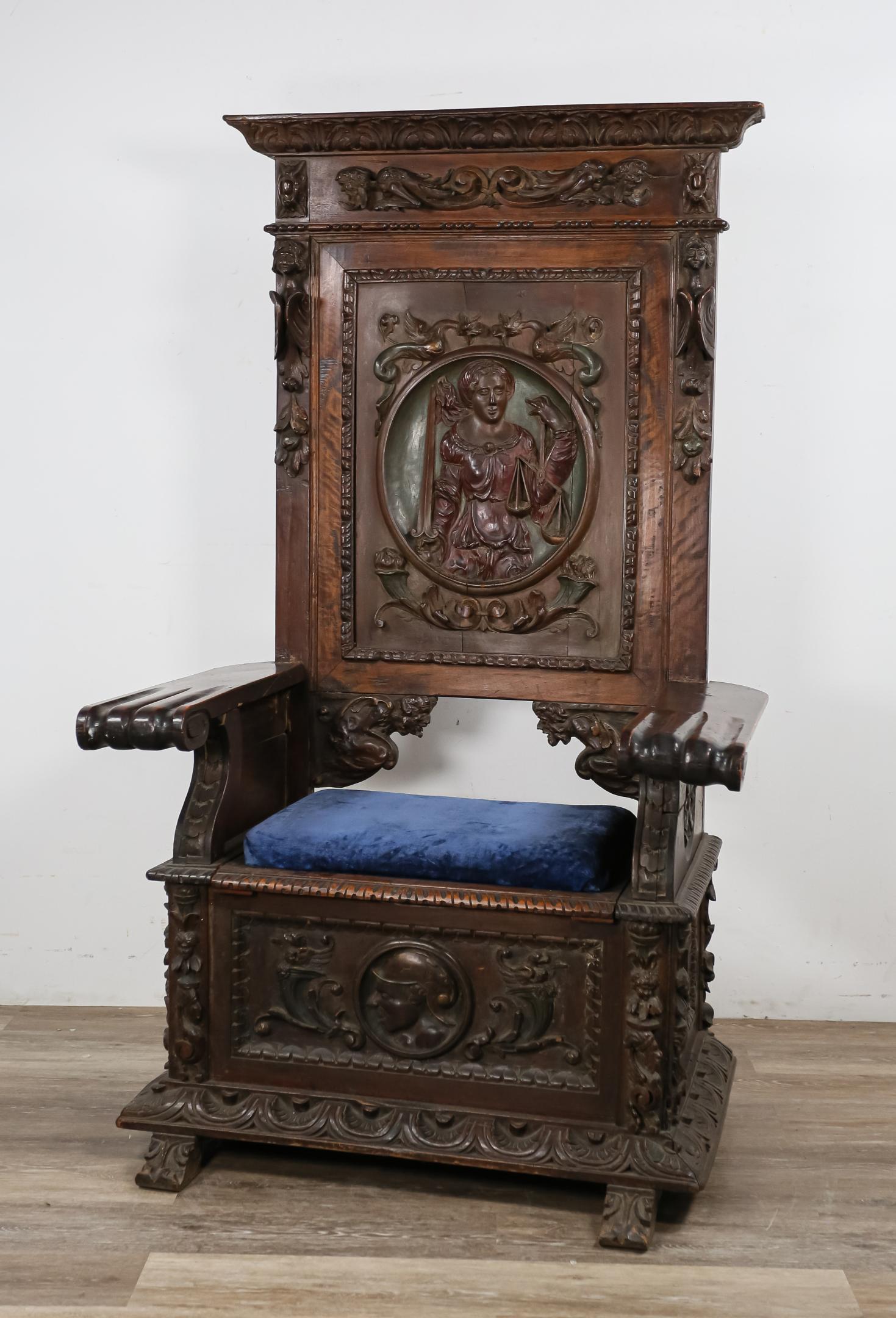 Carved English Renaissance Throne Chair: Carved English Renaissance/ Elizabethan throne chair. Pre-20th century. Heavily carved oak, painted figural carving of personification of Justice on back, lift top seat. Reupholstered, wear and scratc