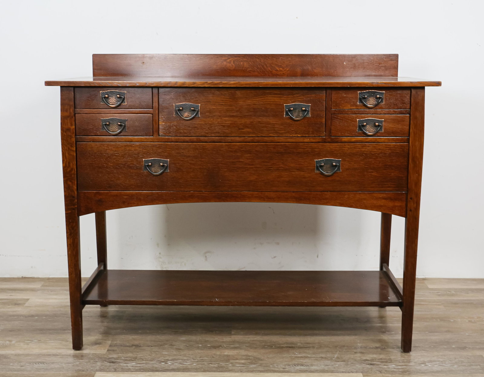 L. & J.G. Stickley Audi Sideboard By Harvey Ellis: L. & J.G. Stickley / E.J. Audi (1974-). A reproduction of a Harvey Ellis (Rochester 1852-1904) sideboard number 800. Marked inside of drawer with a "Stickley" brand, circular metal tag and paper label
