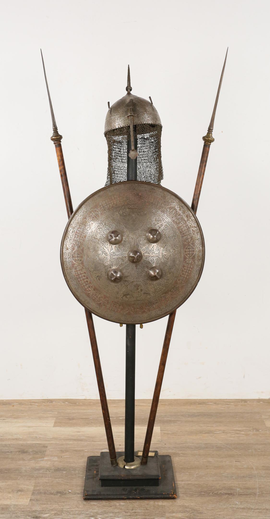 Indo Persian Armor and Spears Museum Style Display: Indo Persian armor and spears. 18th Century. Indo Persian Kulah Khud steel battle helmet, shield and two spears. Helmet engraved with floral pattern at the top and with script around the edge. Chain m
