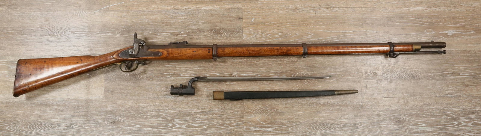 1862 Tower Enfield .577 Caliber Rifle with Bayonet: 1862 Tower Enfield .577 caliber percussion rifle with Bayonet. Side plate stamped "Tower 1862" with crown behind lock, wood stock with fixed front sight and ram rod. Bayonet with leather cover and sta
