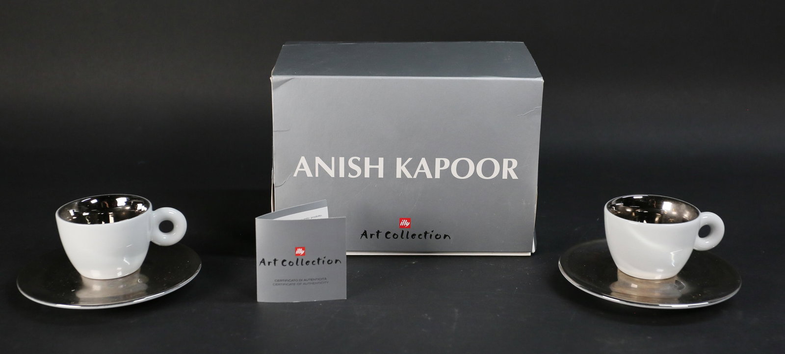 Anish Kapoor Illy Art Collection Espresso Set: Anish Kapoor (Indian/British, b. 1954) 2 porcelain espresso cups and saucers for illy art collection, 2011. With original packaging and inserts. Cups signed on the underside by the artist. Made in Ita