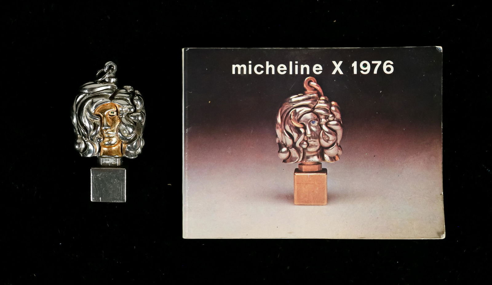 Miguel Berrocal Micheline X Pendant: Miguel Ortiz Berrocal (Spanish, 1933-2006) Micheline X, Opus 139. Chrome plated brass pendant sculpture. With booklet. Signed on the base. 2" H x 1/2" W x 1/2"D.