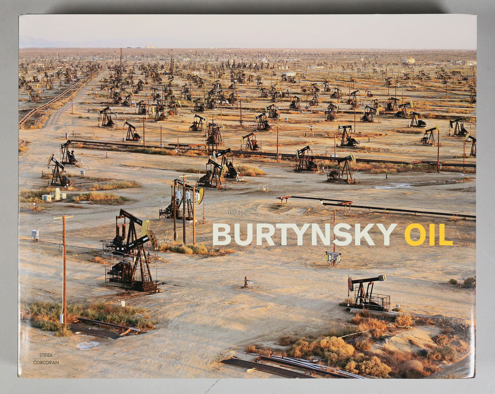 Edward Burtynsky Oil, Signed Book: Photographs by Edward Burtynsky. Essays by Michael Mitchell etc. First Edition. Published by Bernard Fischer, Gerhard Steidl, 2012. Printed in Germany. Signed on the title page in marker. 14 1/2" x 11