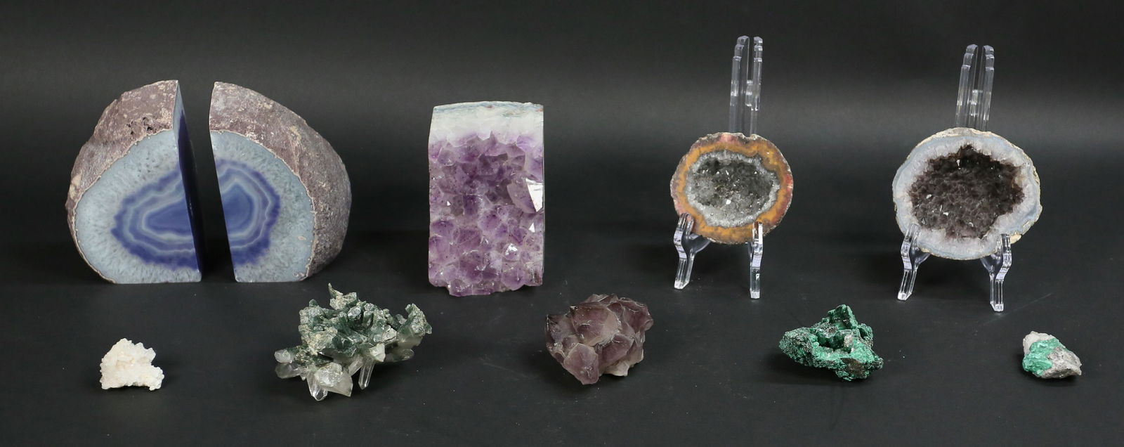 Collection Of Mineral Specimens: Amethyst and 5 other specimen pieces. Two half geodes and a pair of bookends. Tallest 5 1/2"