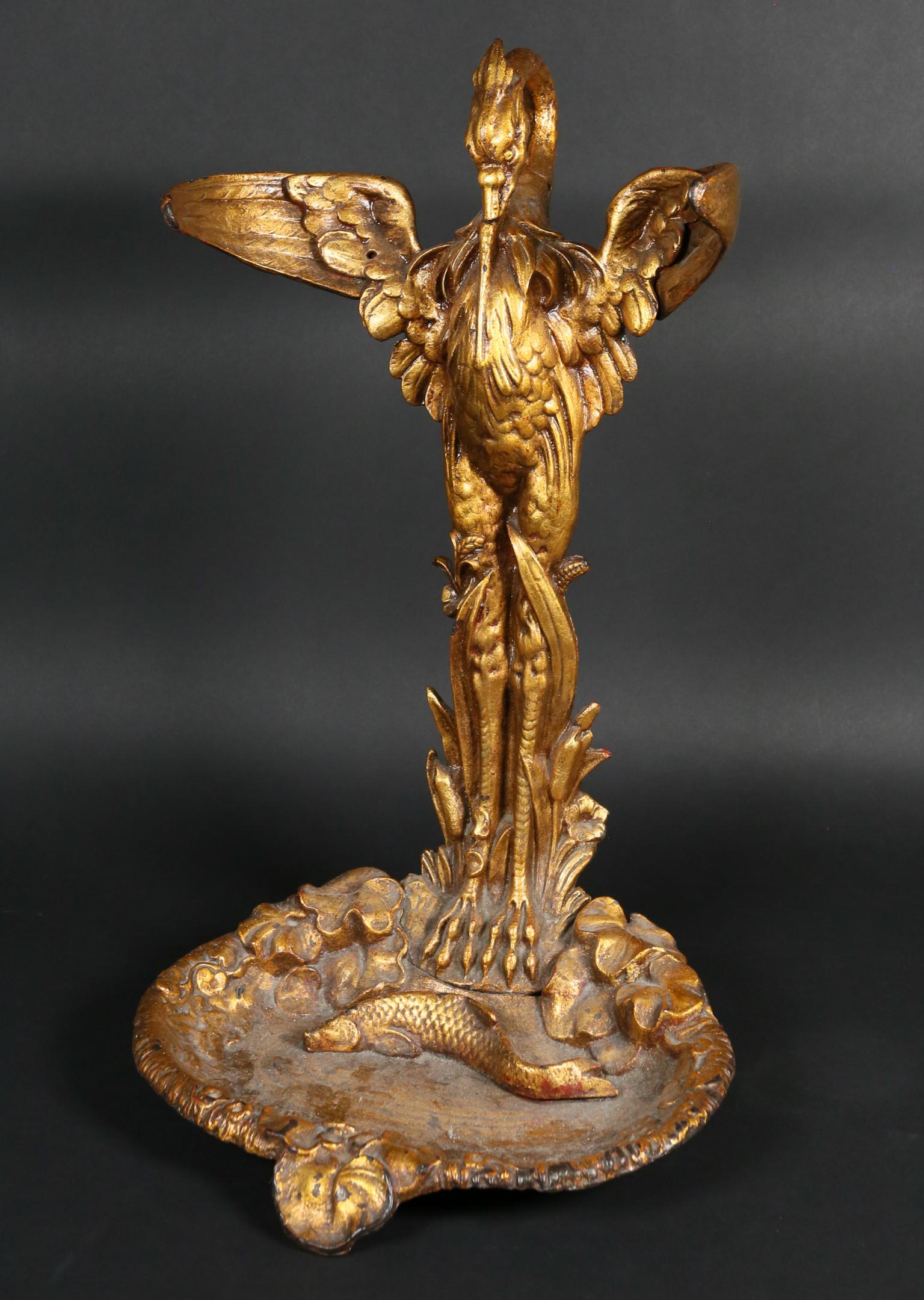 Victorian Cast Iron Umbrella Or Cane Stand: Gilt painted cast iron stand with stork / egret and fish motif. Appears unsigned. Loss to paint on legs, wings, fish, neck and base. 21" H x 12" W x 10" D