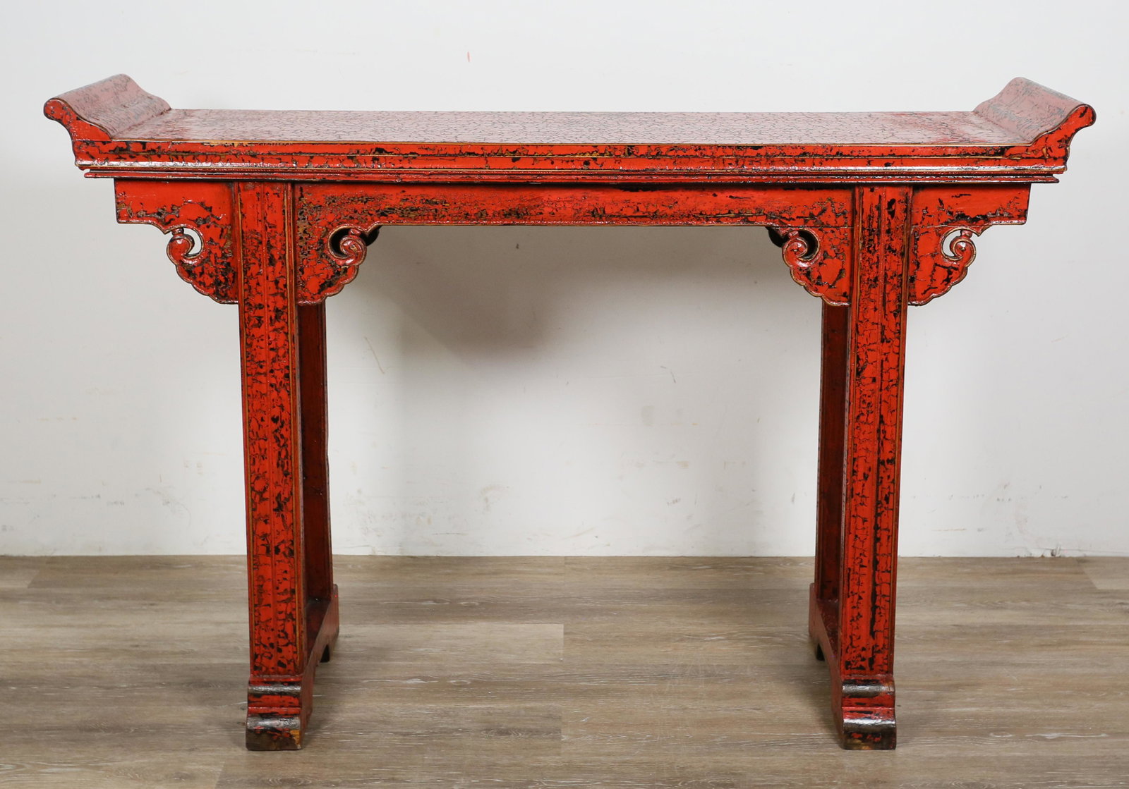 Contemporary Chinese Style Altar Form Console: Contemporary Chinese style altar form console. 20th century. Carved wood and red lacquer. Small losses to lacquer on edges where molding meets top. Splitting to fretwork on apron. 35 1/2" H x 54" L x 