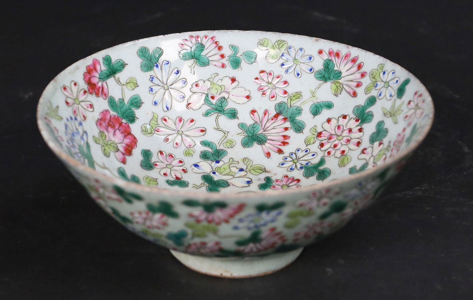 Chinese Export Porcelain Bowl: Chinese export porcelain bowl. Celadon ground and hand painted floral decoration. Marked on the underside with blue Chinese character and export wax seal, additional paper label on side. 2 3/4"H x 6 3