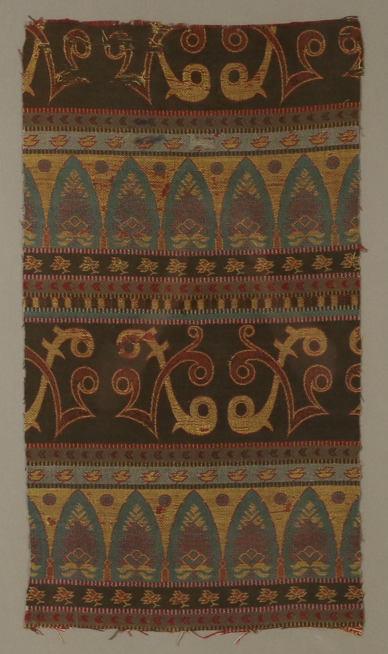 Southeast Asian Textile: Framed Southeast Asian textile with lotus flower design. Textile 25" x 14" (with frame 35" x 24"). Fraying to edges of textile.