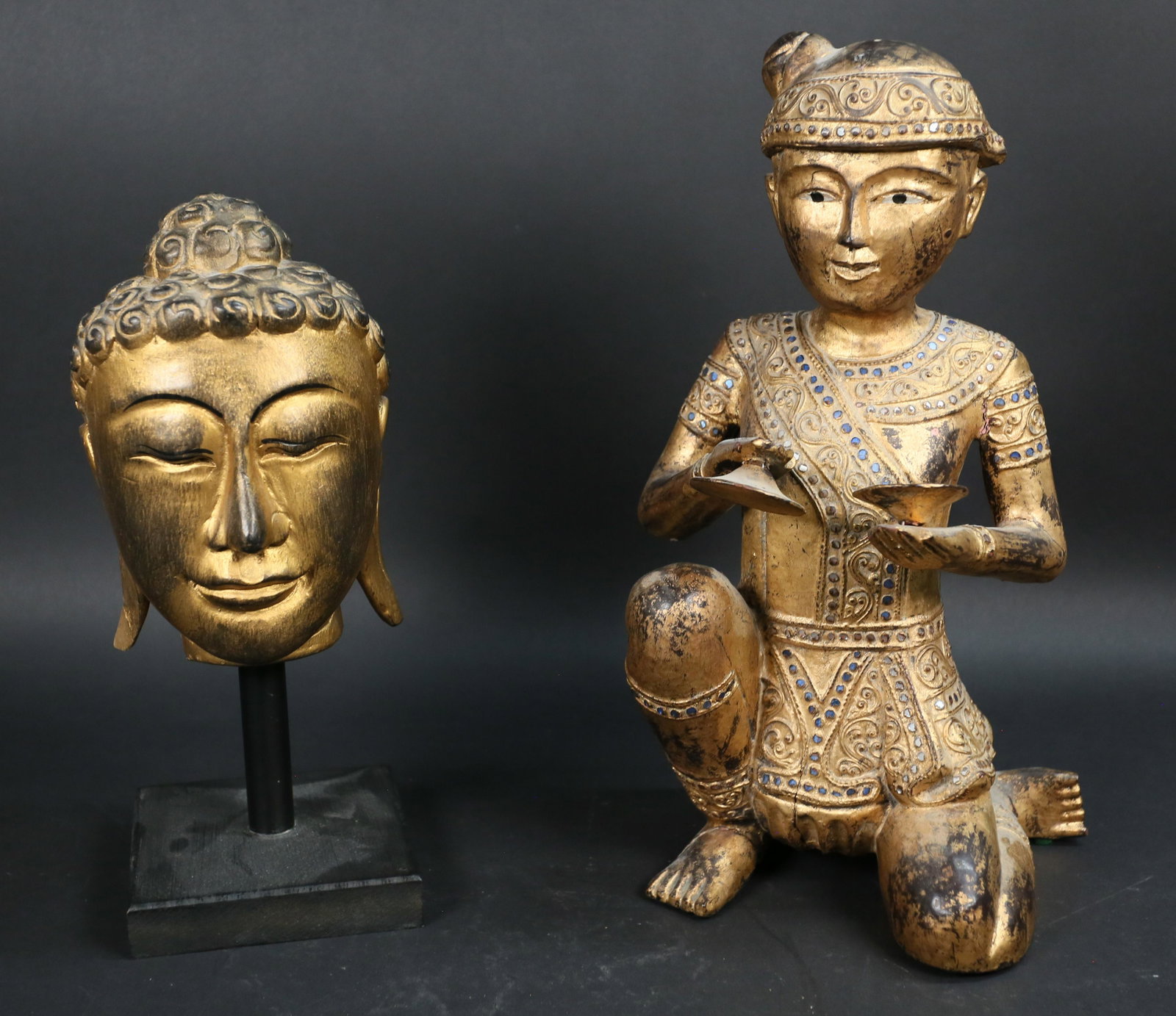 2 Southeast Asian Gilt Wood Buddhist Statues: 2 Southeast Asian gilt wood Buddhist statues. Head 12 3/4"H with stand; cymbal player 15 1/2"H. Losses to gilt decoration on both, some losses to beads on cymbal player, cracks to wood throughout on c