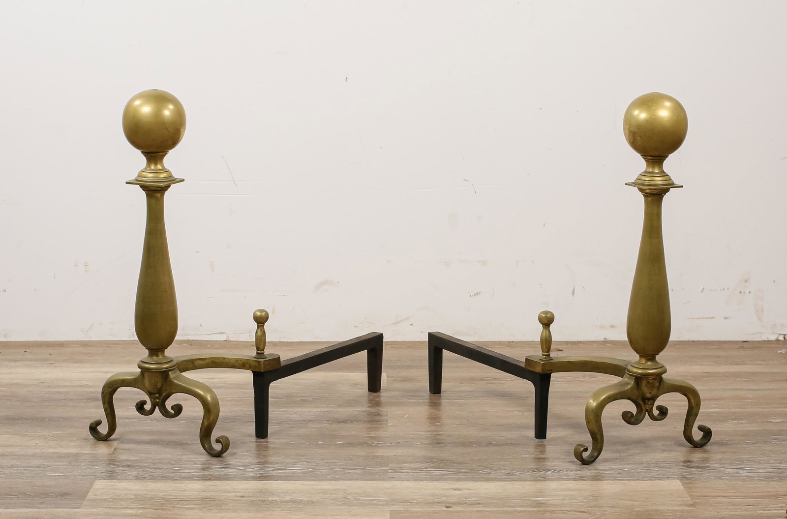 Pair of Brass Ball Top Andirons: Pair of ball top andirons, top of ball has wear and some wear to brass. 23 1/2" H x 10 1/2" L x 23" D.