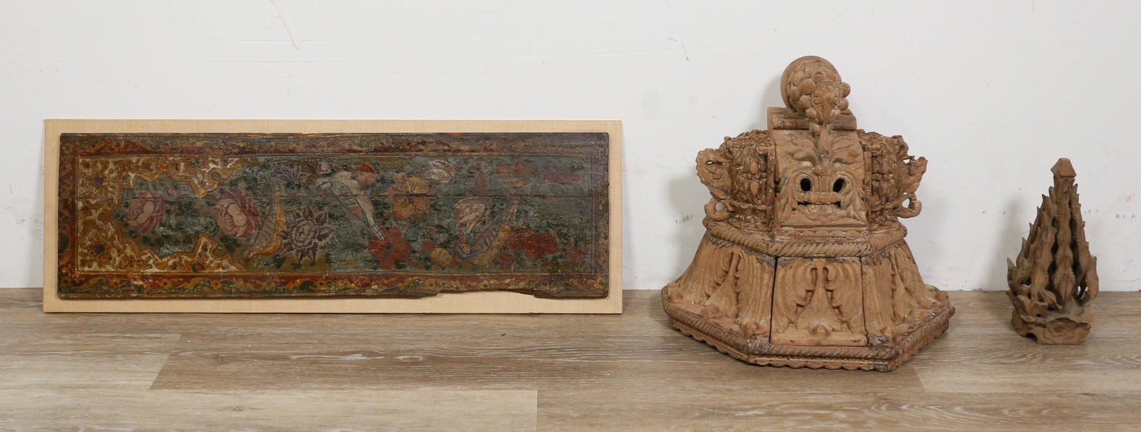 3 Architectural Wood Carvings: 3 wood carvings and architectural elements. Hand painted panel with bird and flower motif, 28 1/2" x 8 1/2" (with mount 30" x 10"); carved corbel or shelf with hidden compartment, 14"H x 14 1/2"W; car