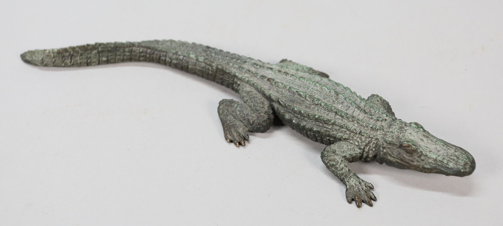 Dian Weeks Bronze Alligator: Dian Weeks (American, 20th century). Cold painted bronze alligator. Signed on the underside and numbered 36/150. 9"L. Minor wear to paint decoration.