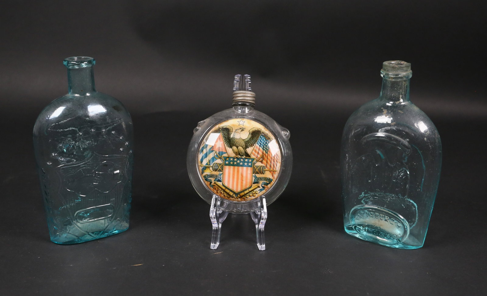 3 Glass Bottles - Union, Pittsburgh and US: 3 glass bottles, Pittsburgh eagle bottle, Union flying eagle bottle with clasped hands, and US glass with painted under glass flag and eagle symbols and marked "U.S. Patent Applied For". 19th/early 20