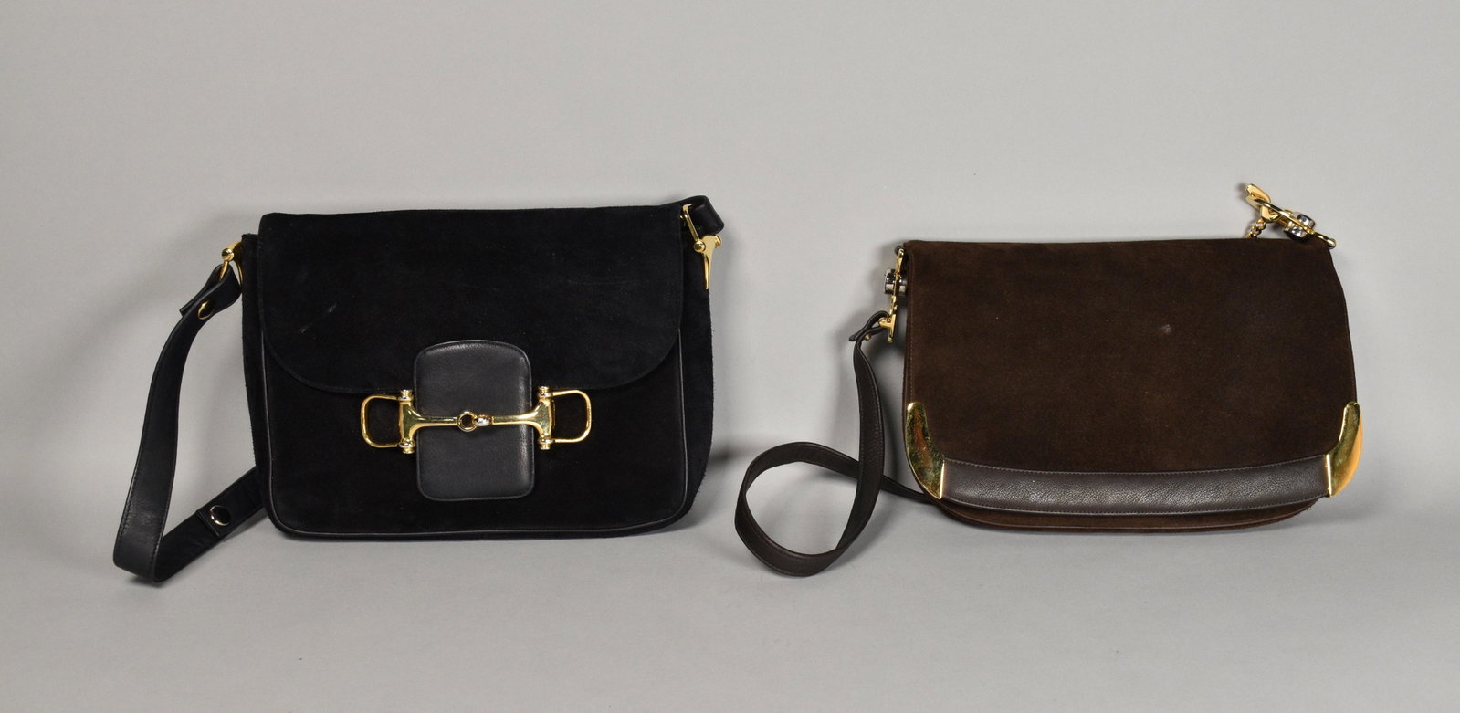 Two Susan Gail Suede Purses: Lot includes black suede Susan Gail purse with gold tone equestrian hardware, front flap closure, single shoulder strap, leather interior with one zipper pocket and one slip pocket, minor marks, good 