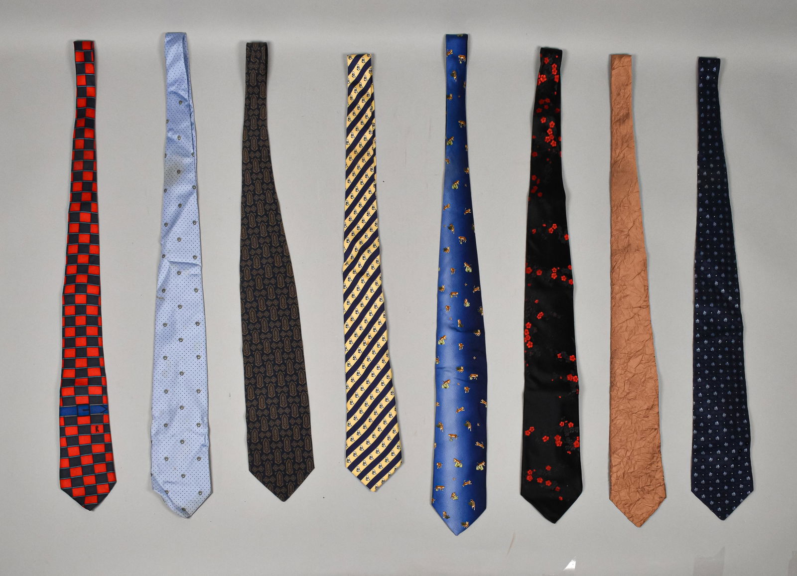Grouping of Designer Silk Neckties ties: Hermes, Georgio Armani, Issey Miyaki, Mimi Fong, Krizia Uomo, Baruch Shemtov, Dormeuil, Gianni Versace, Roberta di Camerino, some with marks consistent with use