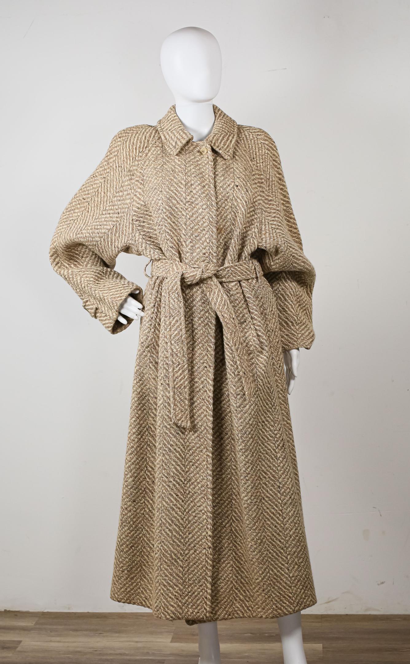 Burberrys Wool Long Coat: Burberrys taupe Irish Tweed belted coat, button front, 100% wool, some marks and spots from wear, good condition.