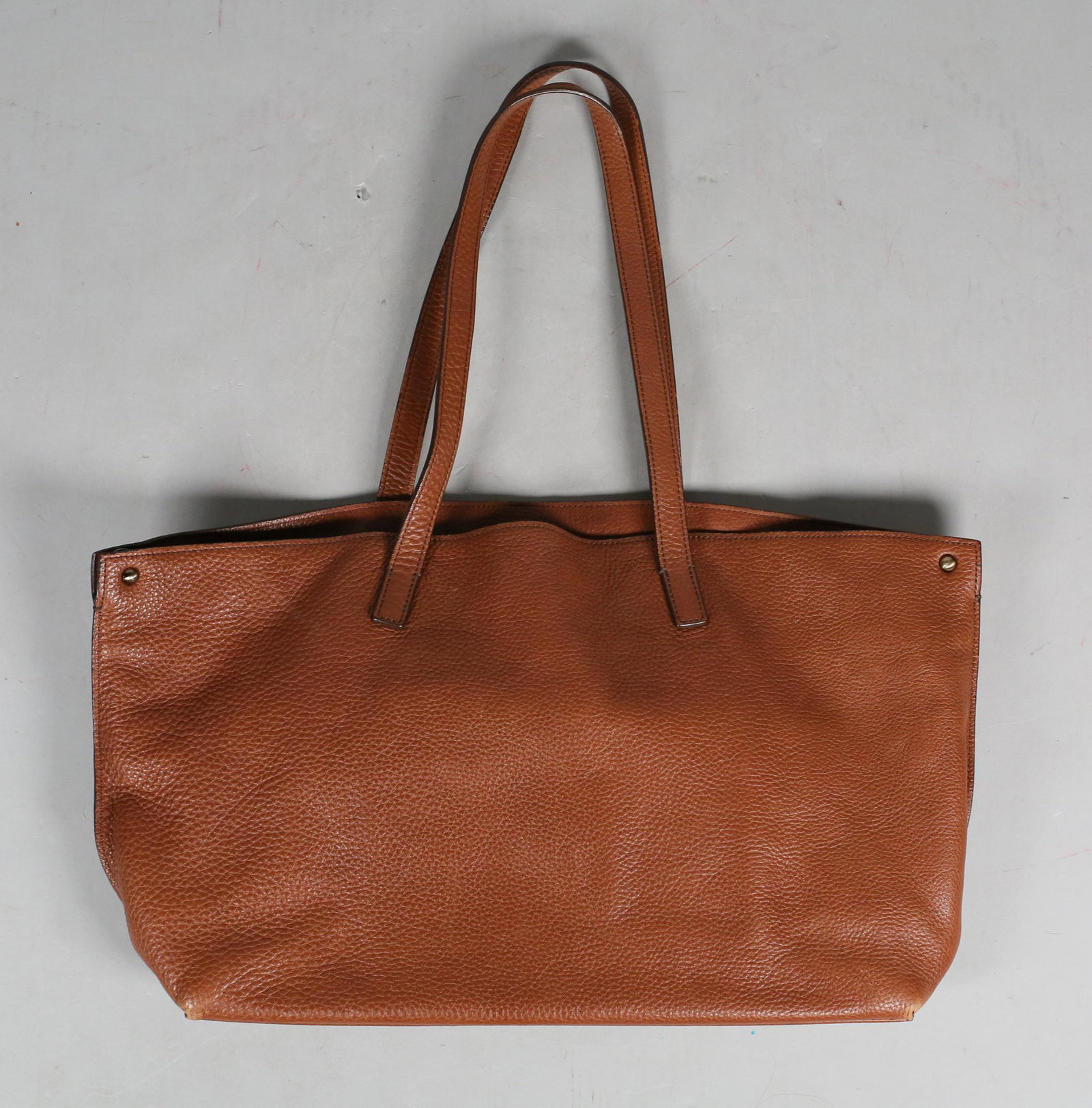 Akris Shoulder Bag: Akris brown leather shoulder bag with silver-tone hardware, turn-lock closure at top, dual shoulder straps, twill lining & three interior pockets, protective feet at base, includes interior zip pouch,