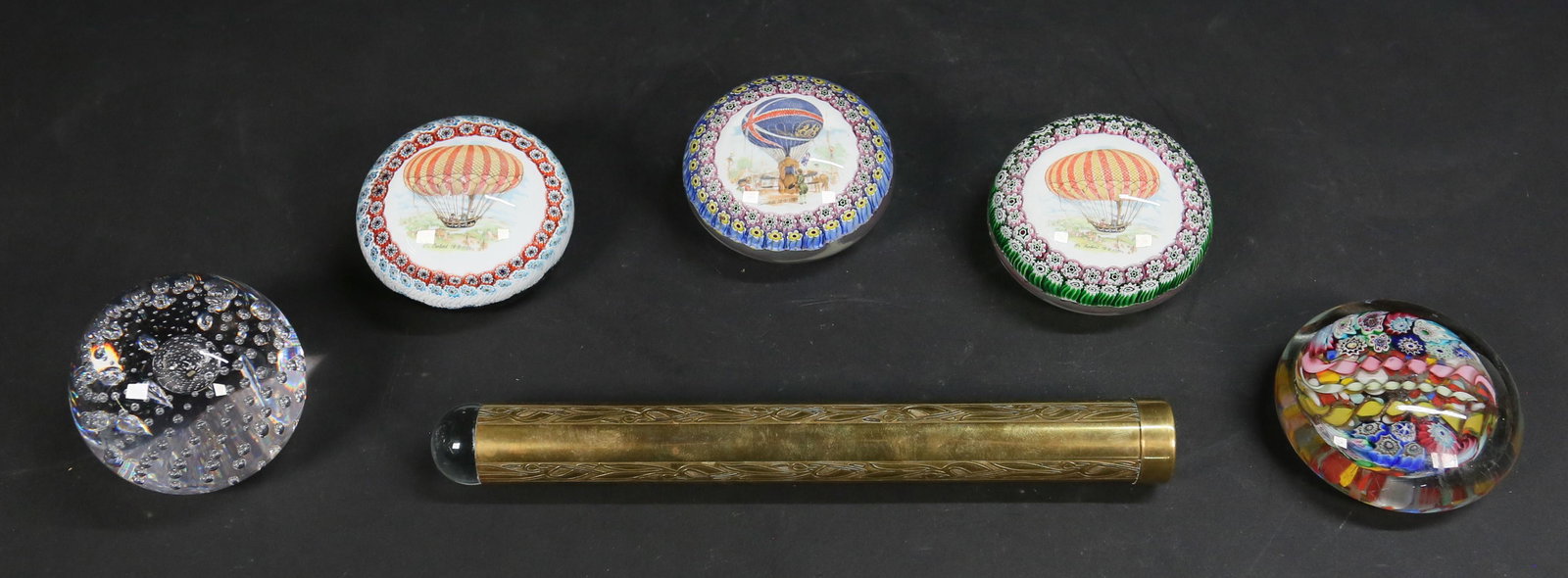 5 Glass Paperweights and Brass Kaleidoscope: Grouping includes four millefiori art glass paperweights, one with millefiori center, two with millefiori caned rim and center commemorating a hot air balloon with inscription Fr. Robert 19-9-1789, on