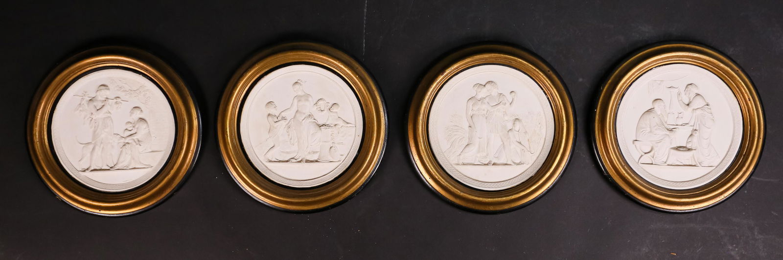 4 Royal Copenhagen Eneret Porcelain Plaques: 4 Royal Copenhagen Eneret bisque porcelain plaques. Each 5 1/2"-diameter (with frames 7"-diameter). Minor discoloration to all, chips and scratches to frames.