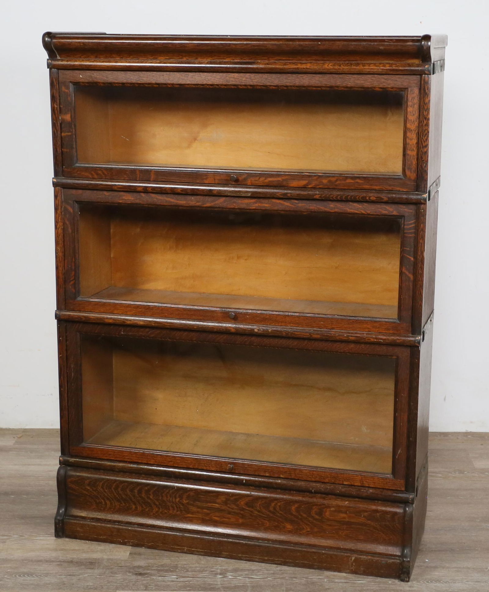 Macey Barrister Cabinet Style Stack Bookcase: Macey barrister cabinet style stack bookcase. Early 20th century. Barrister style glass sliding doors, three cabinet tiers with crown and base. Top and base marked "MACEY SECTIONAL BOOKCASE QUARTERED