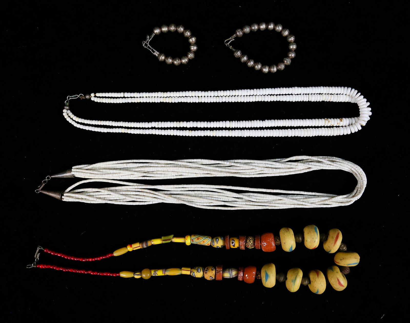 Lot of Beaded Jewelry: Lot of beaded jewelry. 3 necklaces - 1 with sterling clasp. 2 small sterling beaded bracelets. Necklace with silver clasp 24"L, bracelets 10.4 grams.