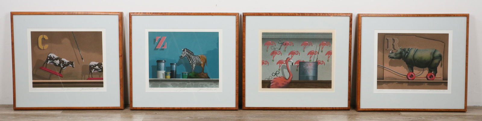 4 James Carter Artist Proof Lithographs: 4 James Carter (American, Connecticut, b. 1948) lithographs, artist proofs. Windup, Electric Rhino, Zebra and Toy Cow. Signed in pencil lower right. In Birdseye maple frames. 13 1/2" x 16" (with frame