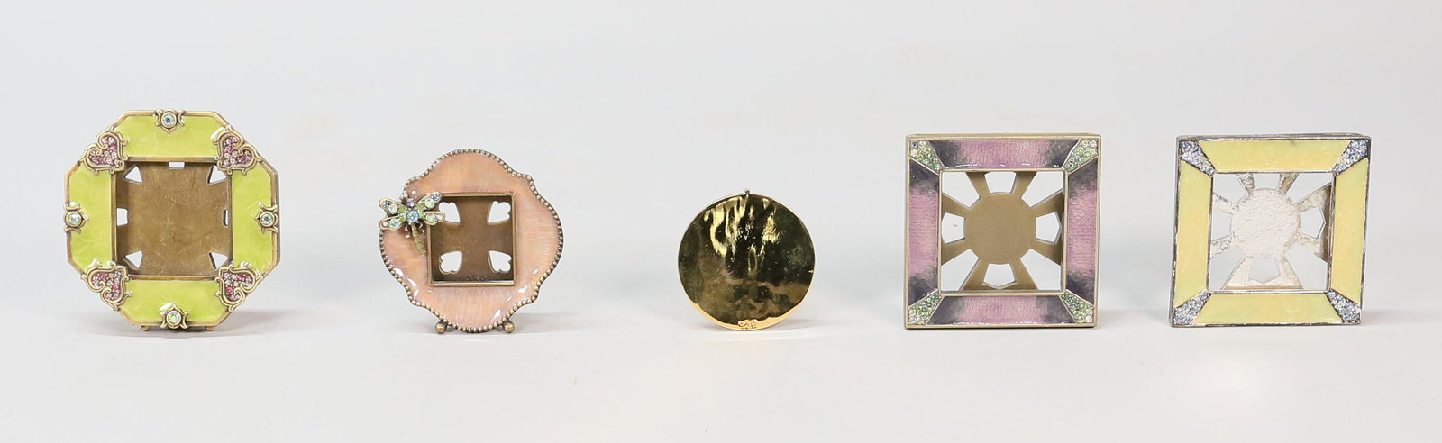 4 Jay Strongwater Frames: Jay Strongwater (American, 1960-). 4 enamel and jeweled frames, with one extra back. All marked Jay Strongwater. Butterfly frame 2 3/4"H, square frames 2 3/4" x 2 3/4", hexagonal frame 3 1/4" x 3". Al
