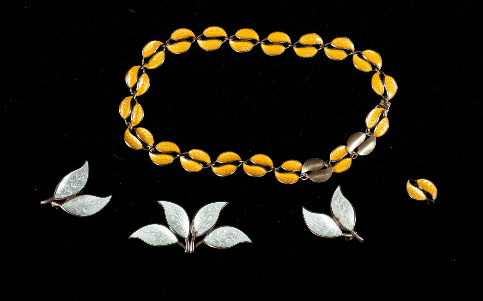 Lot of David Andersen Sterling & Enamel Jewelry: David Andersen (Norway, 20th century-). 5 pieces of sterling silver and enamel jewelry. Matching choker and single earring, matching brooch and pair of earrings. All marked D-A 925 sterling Norway. Ch