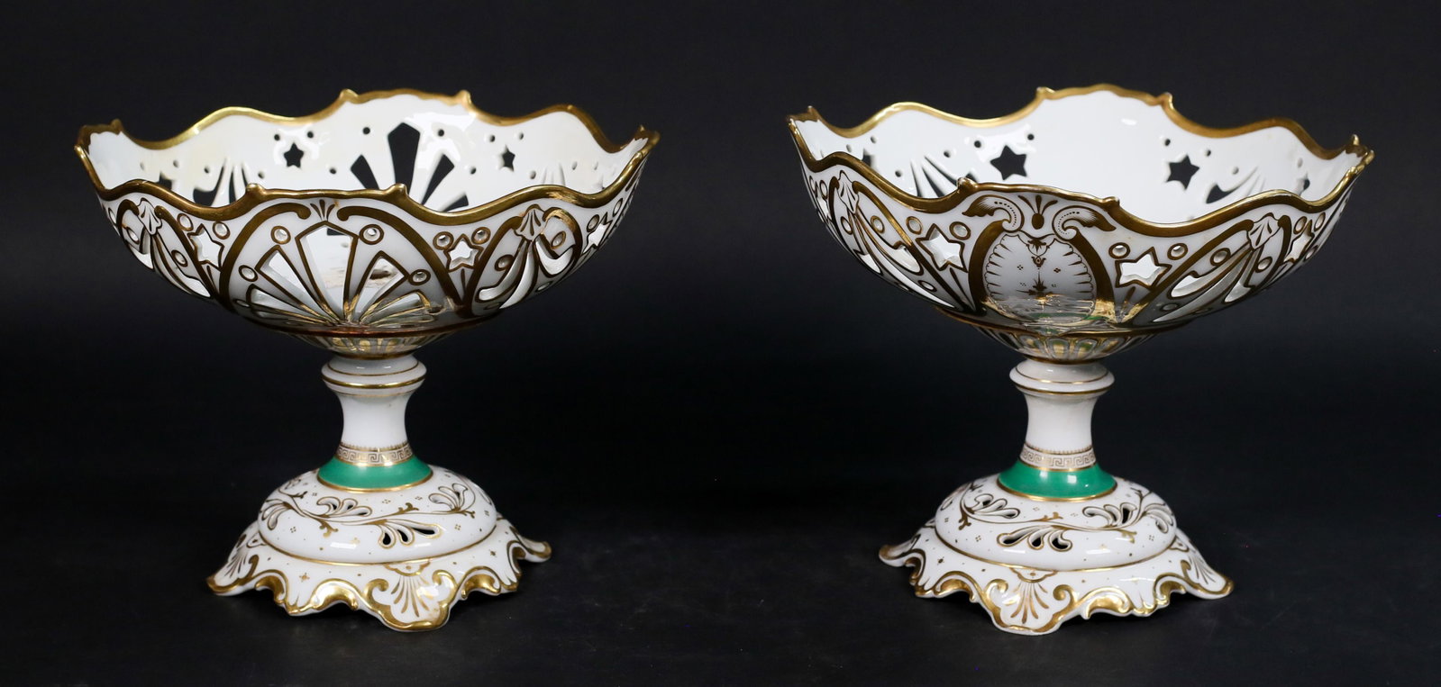Pair Meissen Style Porcelain Compotes: Pair of Meissen style porcelain compotes or fruit bowls. Unmarked. Each 8"H x 9 1/2"-diameter. Minor losses to gilt decoration, lines and crazing to one pedestal.