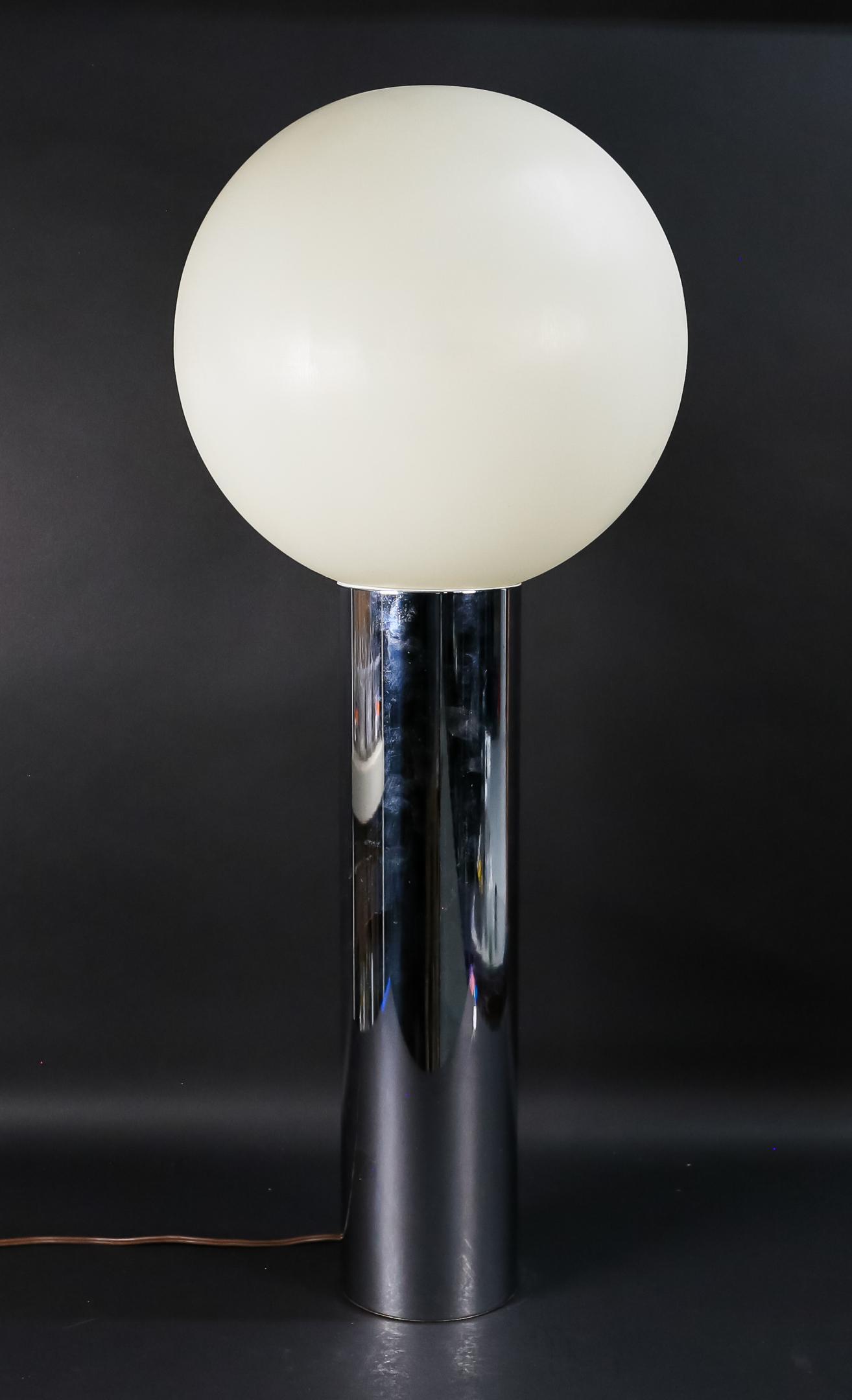 Mid Century Modern Chrome Cylinder Lamp: In the style of Robert Sonneman and George Kovacs lollipop chrome lamp, some scratches to base, socket is bent, plastic globe, some scratches, 12" diameter, 20" H, 33"H with globe.