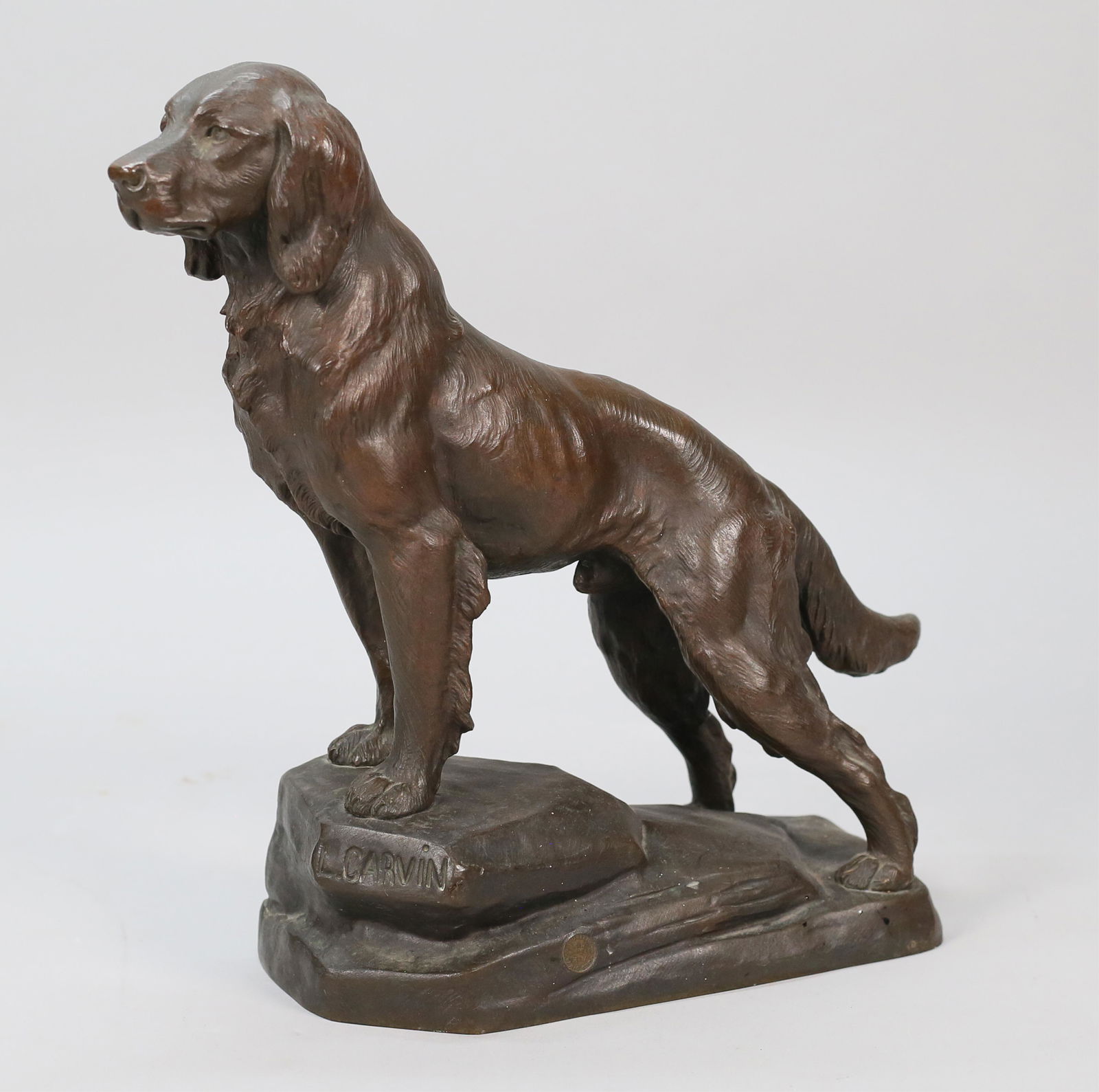 After Louis-Albert Carvin Spelter Dog: After Louis-Albert Carvin (France, 1875-1951). Spelter figure of a dog. Signed on the base L. Carvin. With Exposition Paris 1900 Medal mark on the base. 13"L x 5"W x 13"H.