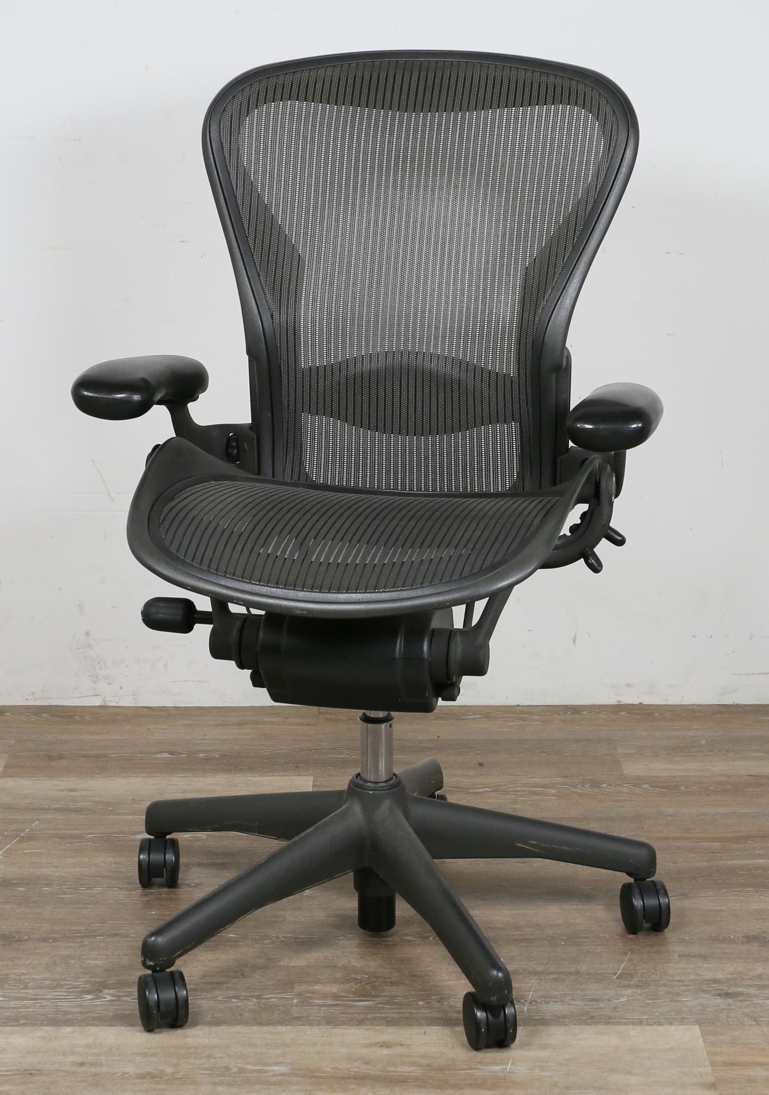 Herman Miller Aeron Office Chair: Don Chadwick (American, born 1936) and Bill Stumpf (American, 1936-2006) for Herman Miller. Black molded plastic and metal with lumbar support and seat adjustments. Herman Miller molded label on back