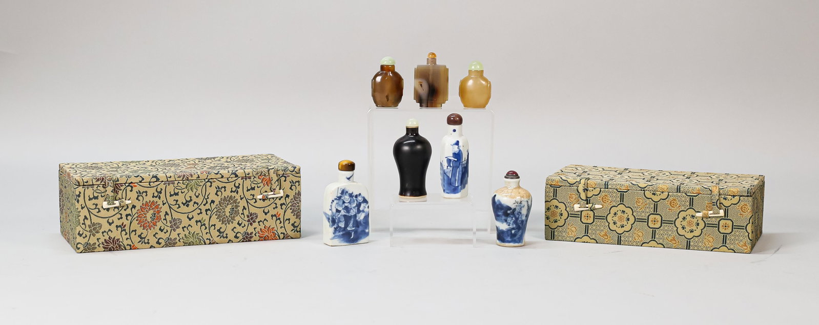 7 Porcelain, Pottery & Hardstone Snuff Bottles: 7 Chinese porcelain, pottery and hardstone snuff bottles. 3 hardstone bottles, tallest 2 1/8"H; pottery bottle with hardstone top, 3"H; 2 blue and white porcelain bottles with hardstone tops, warrior 