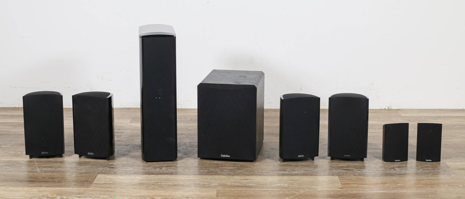 Grouping of Definitive Technology Audio Equipment: Grouping of Definitive Technology audio equipment. Baltimore, MD, 21st century. CS8040HD center speaker, Powerfield Subwoofer, 2 ProCinema ProMonitor60 speakers, and 4 ProCinema ProMontor1000 speakers