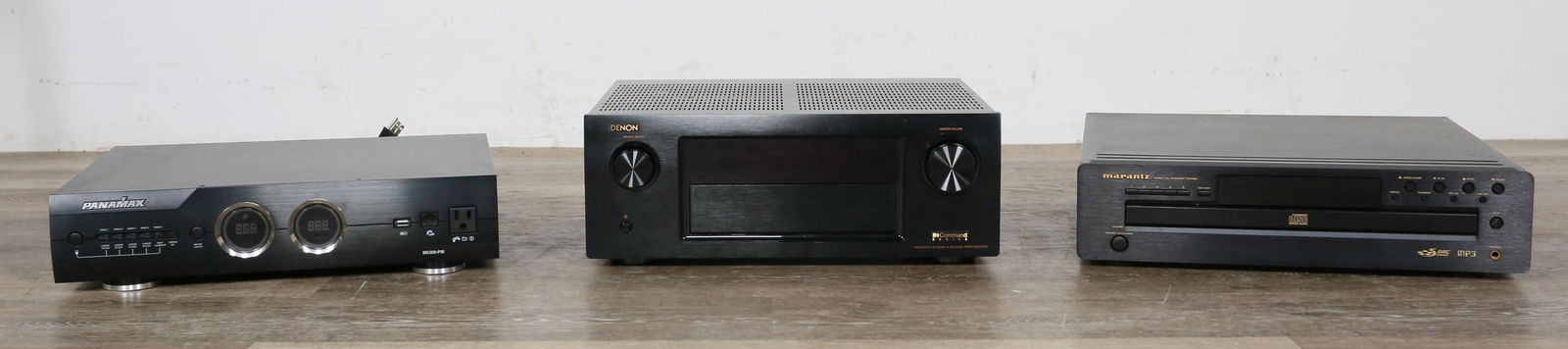 Grouping of TV and Audio Equipment: Grouping of TV and audio equipment. 20th century. Panamax M5300-PM voltage regulator, Marantz 5 disc CD changer CC4001, and Denon AVR-X4200W receiver. All units have been plugged in and turn on. Power