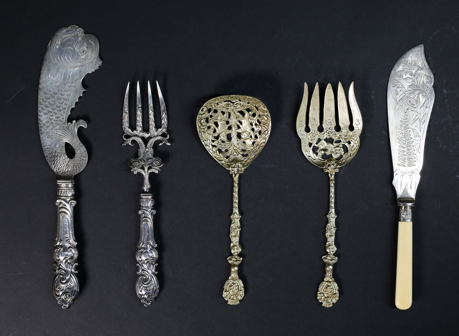 Collection of Fish Servers: One gold tone cherub fish server set, 10" L; one silver plated fish server set, 12"L; one silver fish server with bone handle, crack in handle, 11 1/2"L.