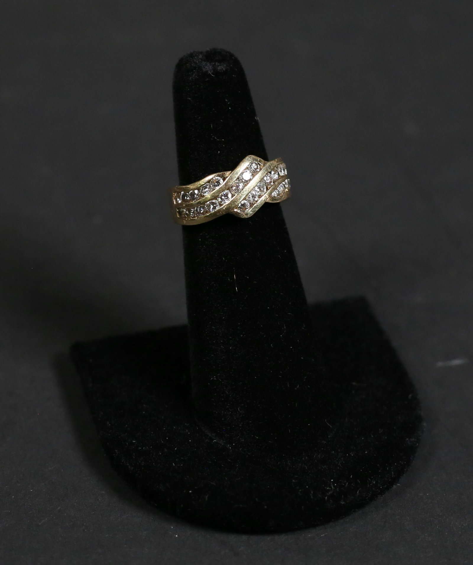 18k Gold and Diamond Ring: 18k gold and diamond ring. Band marked KP, acid tested as 18k. 26 diamonds each approximately .03125 carats. Ring size 5. 6 grams total.