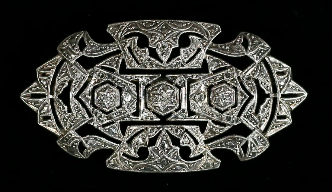 Sterling, Diamond & Marcasite Brooch: Sterling silver, diamond and marcasite brooch. Unmarked, acid tested. Center diamond .125 ct. 2 1/8"L. Total 11 grams including stones.