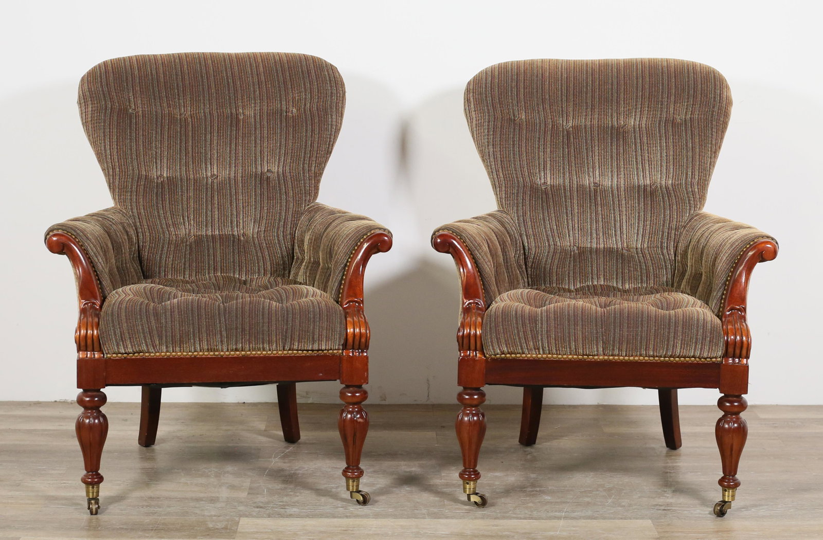 Pair of Edwardian Style Club Chairs: Pair of Edwardian style club or library chairs produced by the Hickory Chair Company. American, 21st century. Polychromatic upholstery, mahogany arms and legs. Hickory Chair Company label on underside