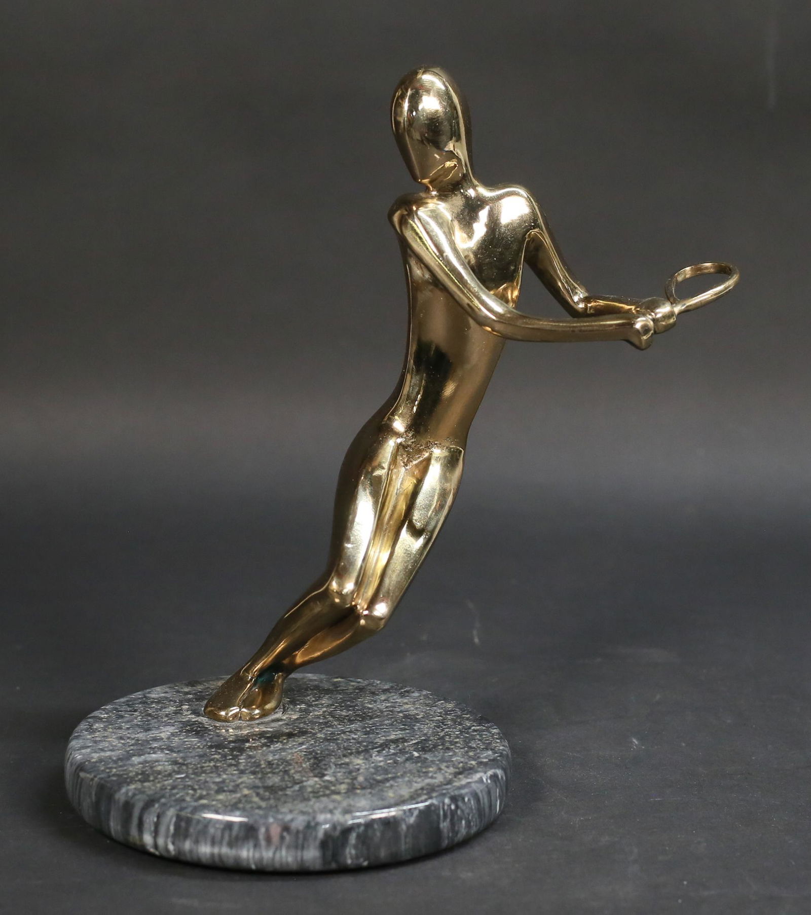 Bob or Tom Bennett Bronze Tennis Player Backhand: Bob Bennett (American, California, 1928-2003) or Tom Bennett (American, California, 1928-). Bronze of a tennis player, Backhand. On marble base. 9 7/8"H.