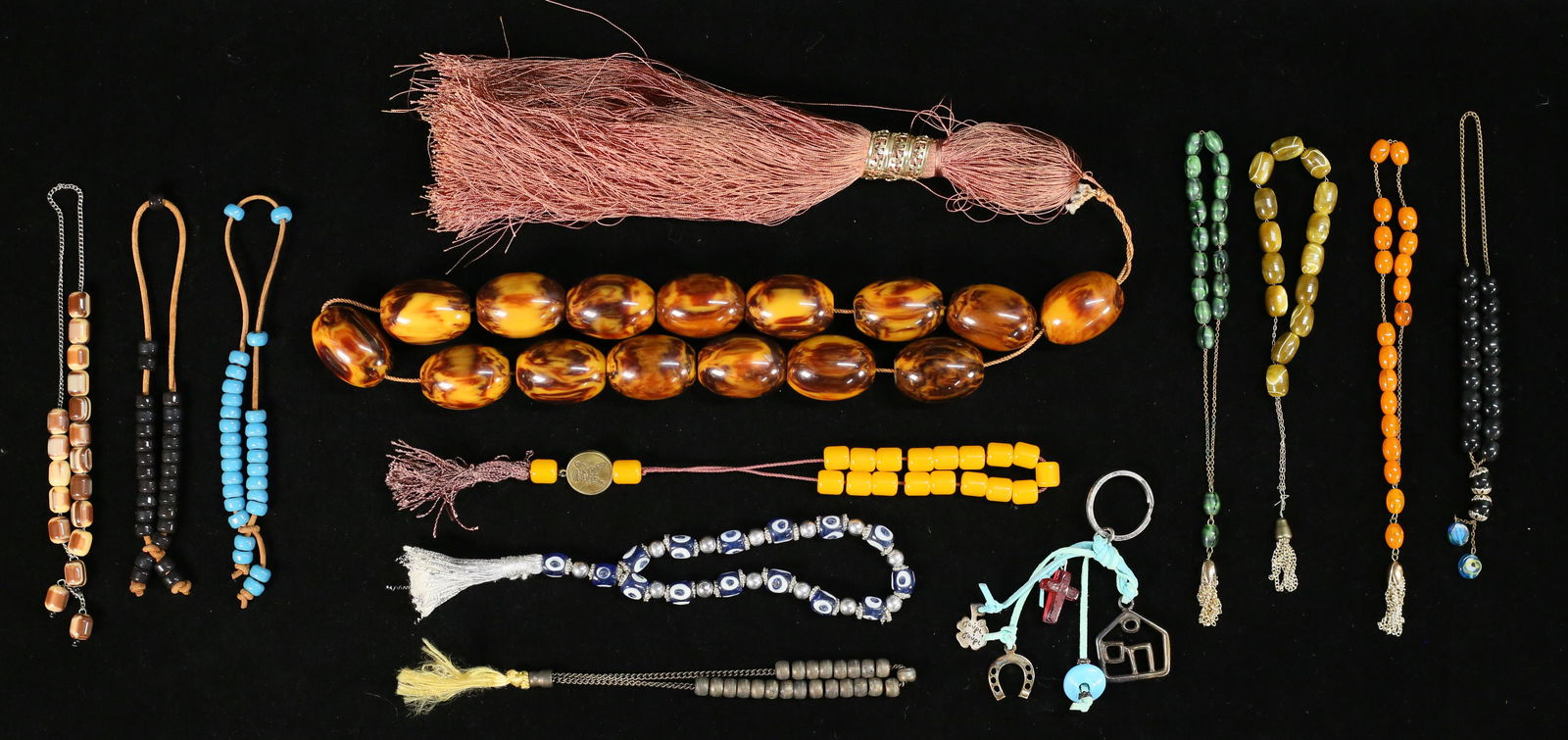 Lot of Prayer Beads: Lot of prayer beads including Bakelite, hardstone, malachite, glass, metal. Largest 27 1/2"L including tassel.