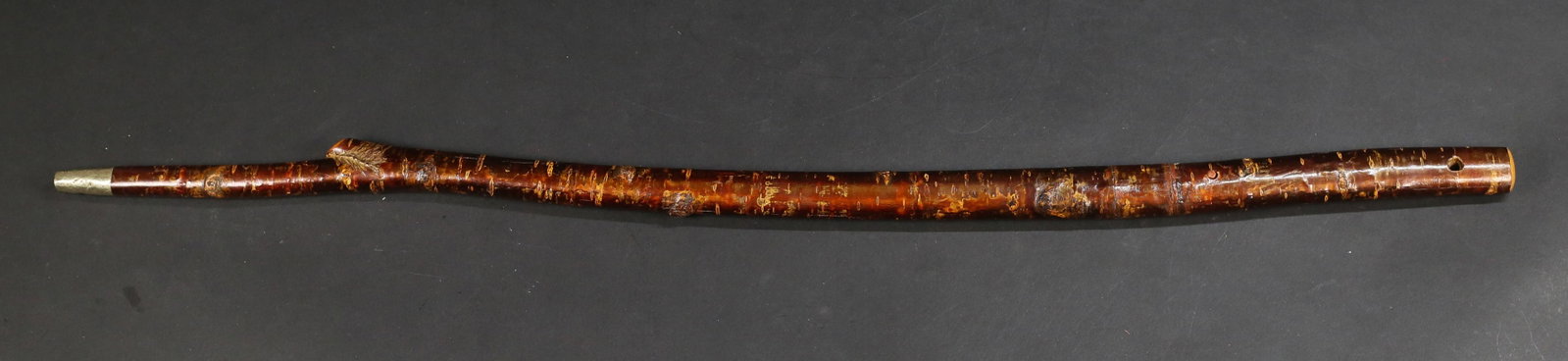 Japanese Sword Cane Shikomizue: 19th Century bark and wood walking stick with concealed sword. Walking stick with metal tip. Handle top with hole for lanyard. Metal at bottom of the cane is rusted and pitted. Minor pitting and the b
