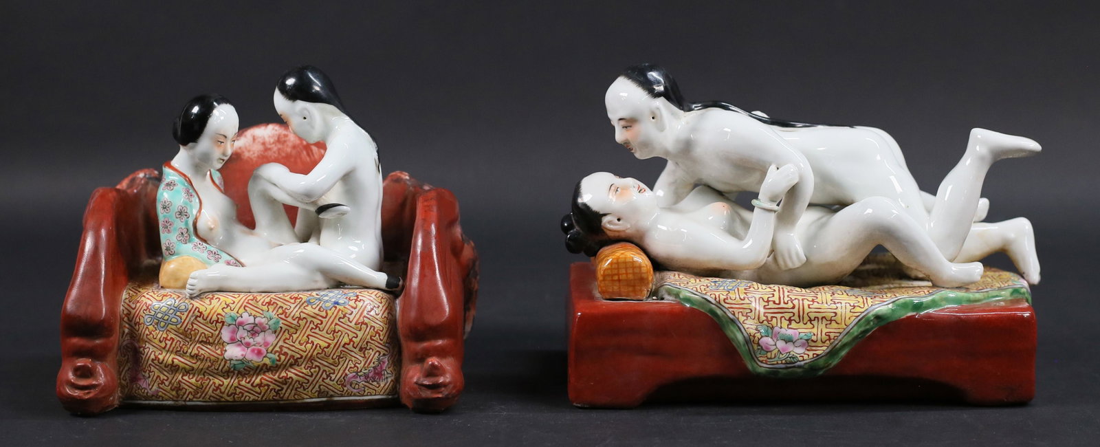 2 Erotic Chinese Porcelain Figures: 2 Chinese porcelain figure groups depicting erotic scenes. Both with impressed marks. 9 1/4"L x 6 1/4"H and 8"L x 6 3/8"H. Loveseat with losses, damage and discoloration to painted decoration on back 
