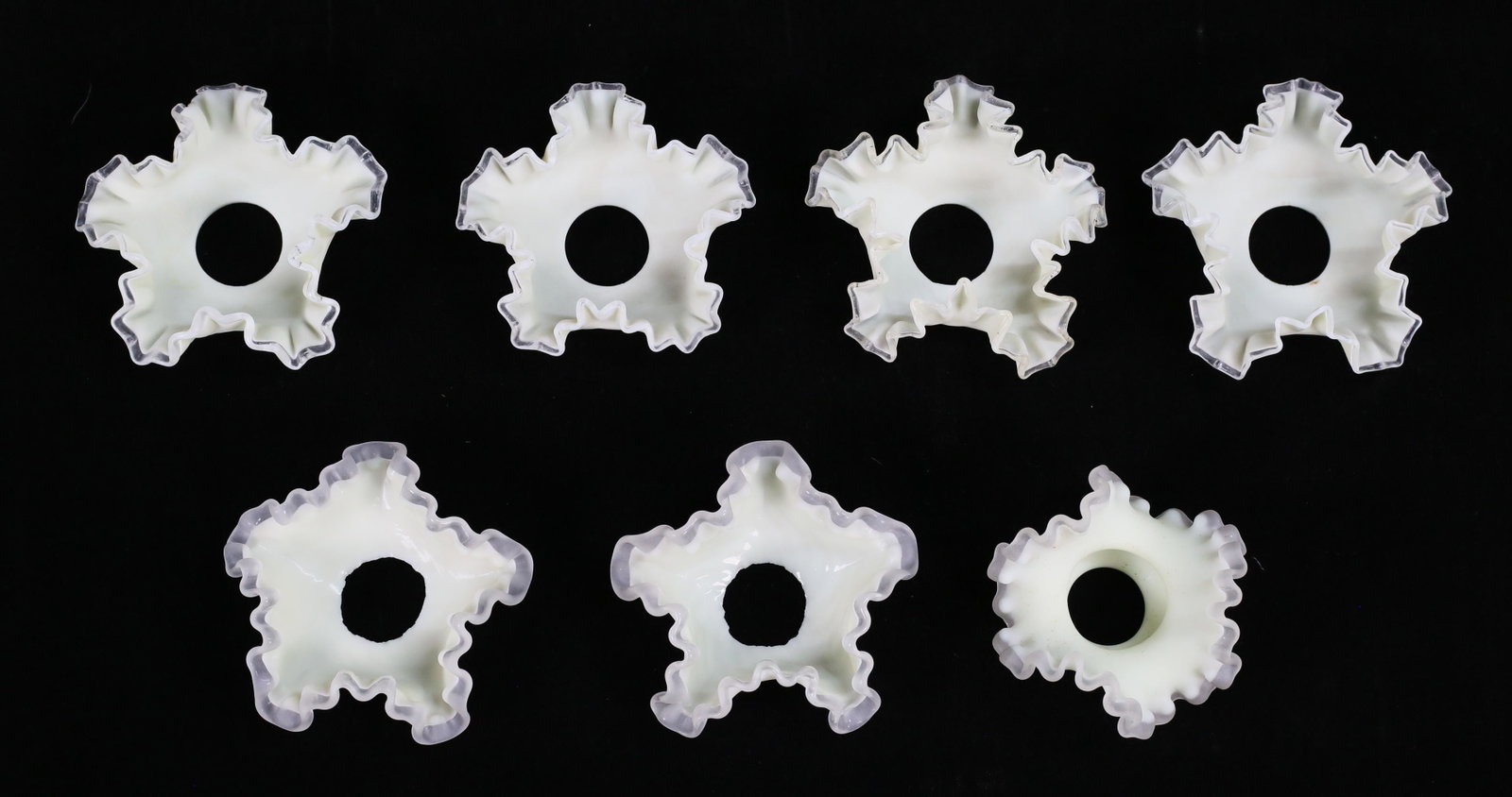 7 Uranium Glass Shades: 7 uranium satin glass ruffled shades. Set of 4, pair and single shade. Each 4 1/2"-diameter. Chip to rim of one shade of set of 4.