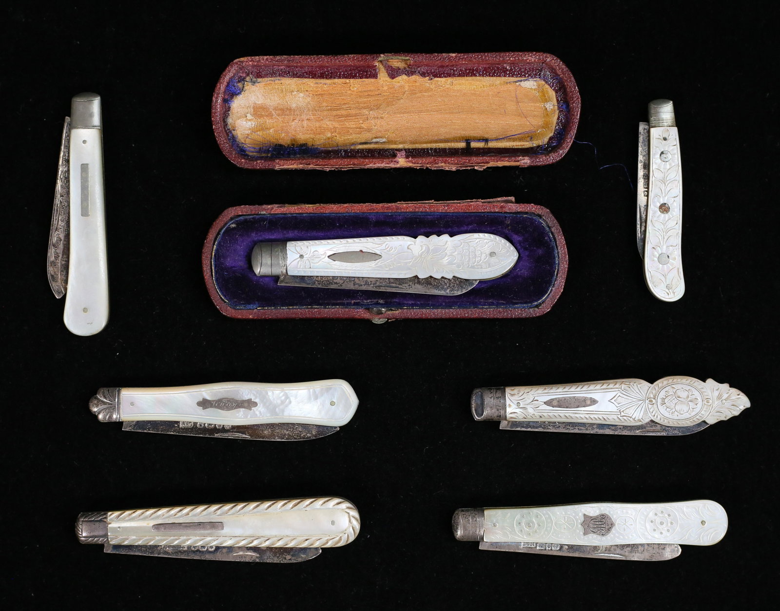 Sterling And Mother Of Pearl Pocket Knives: 7 Victorian era sterling and mother of pearl pocket knives with English hallmarks. One knife case with detached top and bottom. Largest open 6 1/4".
