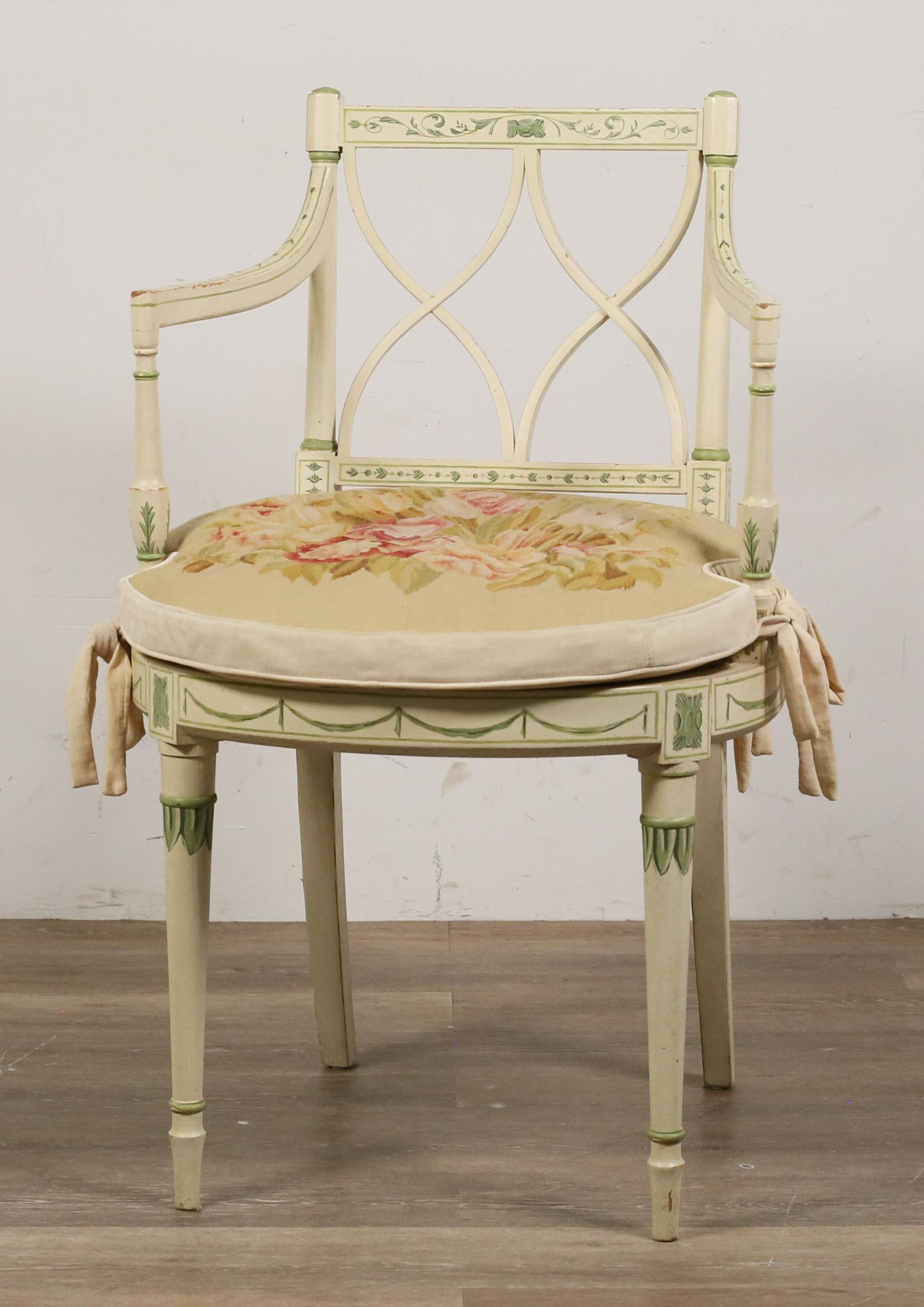 Caitlin Wilson Neoclassical Style "Diana Chair": "Diana" chair produced and designed by Caitlin Wilson (San Francisco, CA, 21st century.) Cream-colored armchair in French Neoclassical style with green-painted motifs, tapered legs, and caned seat wit