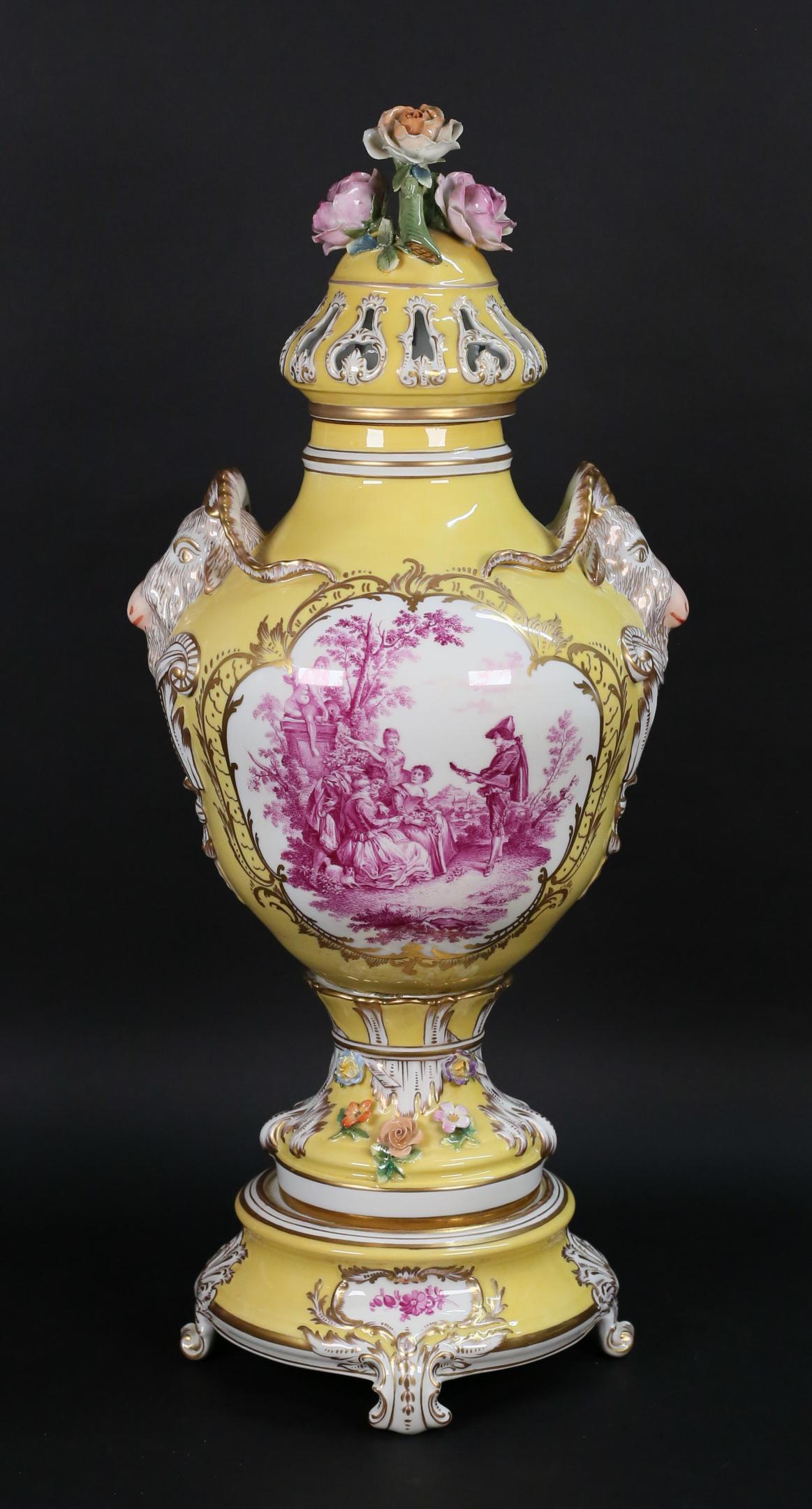 Carl Thieme Potschappel Porcelain Urn: Potschappel Carl Thieme Meissen style German style porcelain urn. Yellow ground, hand painted magenta flowers, with gilt painted decoration and applied porcelain flowers, molded figural goat form hand