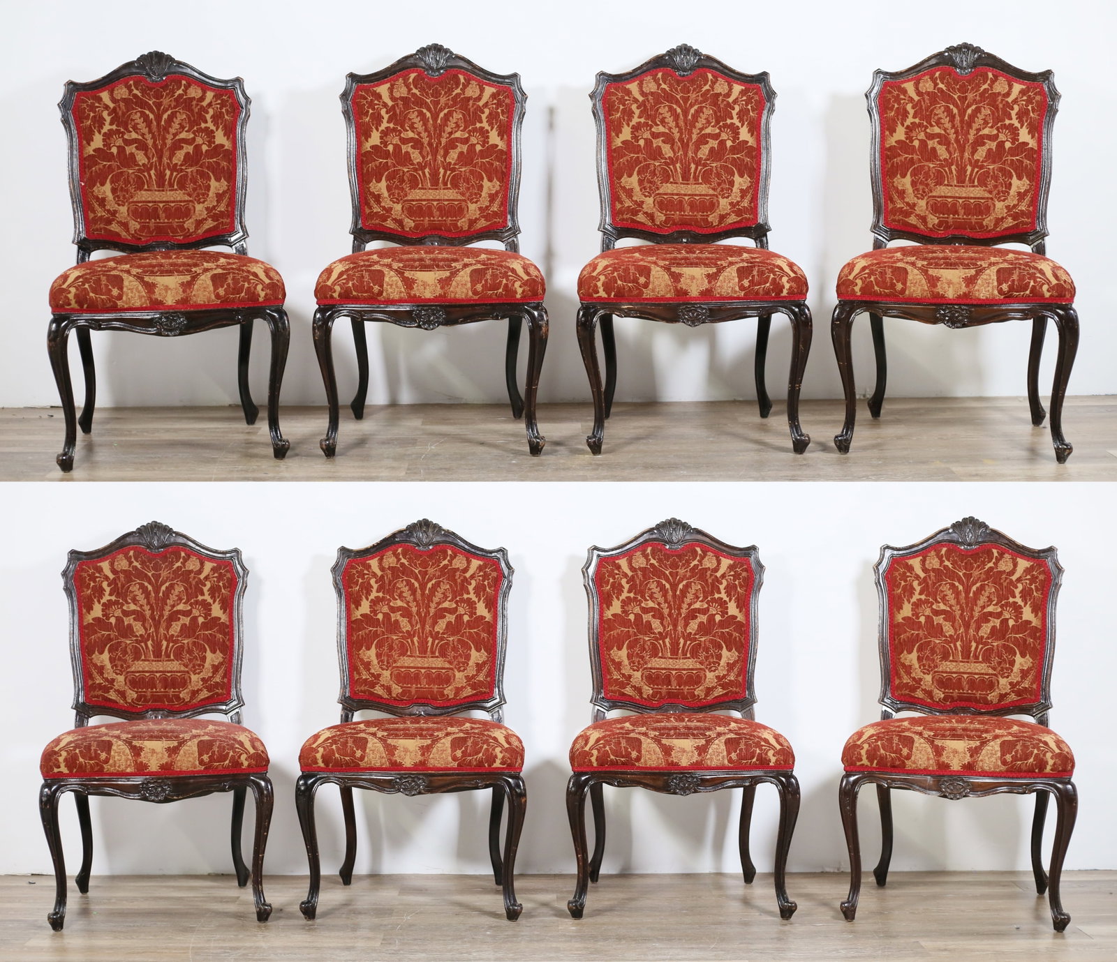 Eight Louis XV Style Dining Chairs: Eight Louis XV style dining chairs. Red and gold floral upholstery, shield form back, cabriole legs. Losses to finish, losses and wear throughout wood frames of all chairs. Heavy scuffs to legs of cha