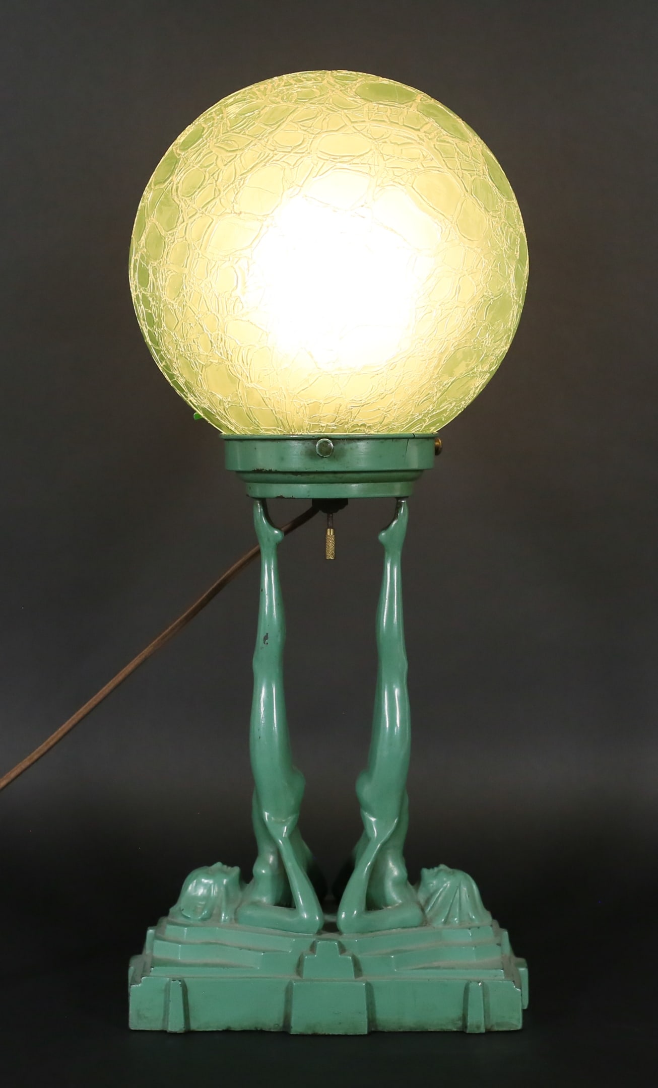 Frankart Art Deco Double Nude Table Lamp: Frankart figural table lamp, circa 1928. Art deco, double nudes supporting a crackle glass globe shade, in green enamel. Signed on the base Frankart and 1928 Pat'd 77202 and signed on the base of each