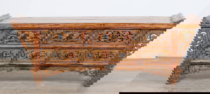 Chinese Low Altar Form Cabinet: Chinese low altar form cabinet. Seven drawers and carved floral fretwork on molding and apron. Large split and crack across top. Repairs to fretwork on apron on right side. Refinishing throughout cabi